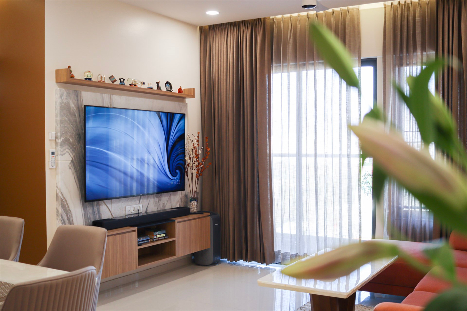 a living room with a tv and a table