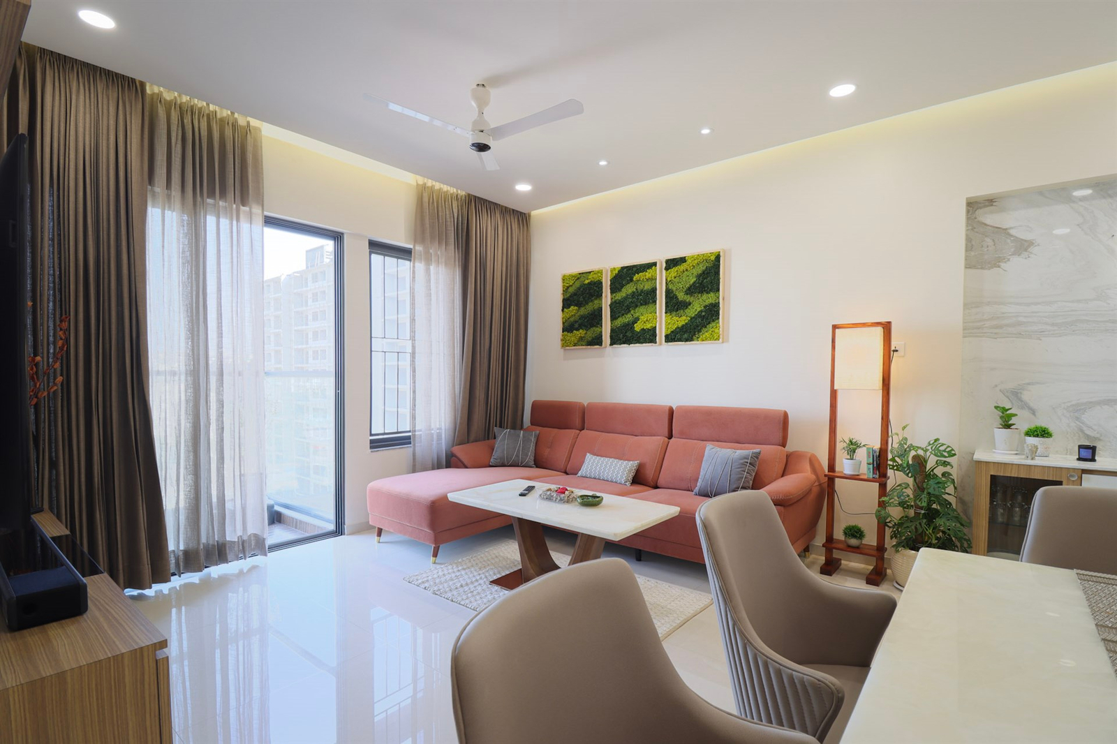 a living room with a couch and chairs