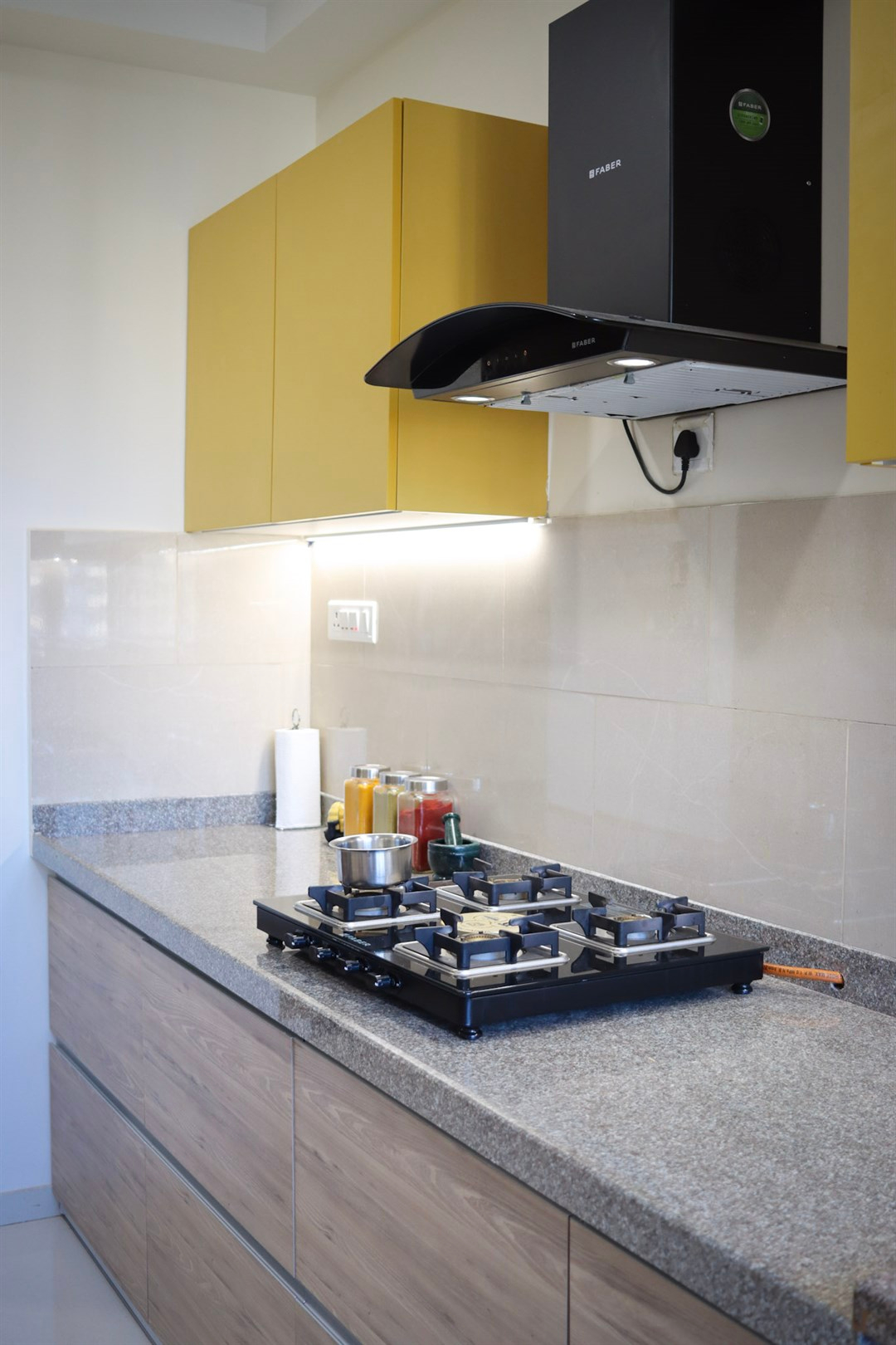 a stove top with a stove hood and a range hood