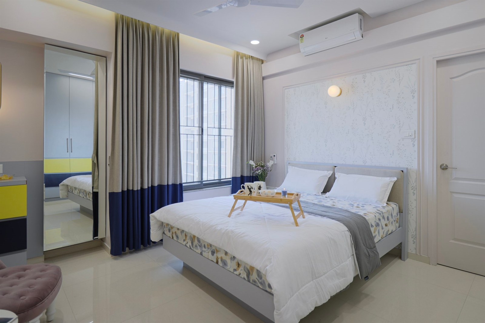 a bed with a tray of food on it