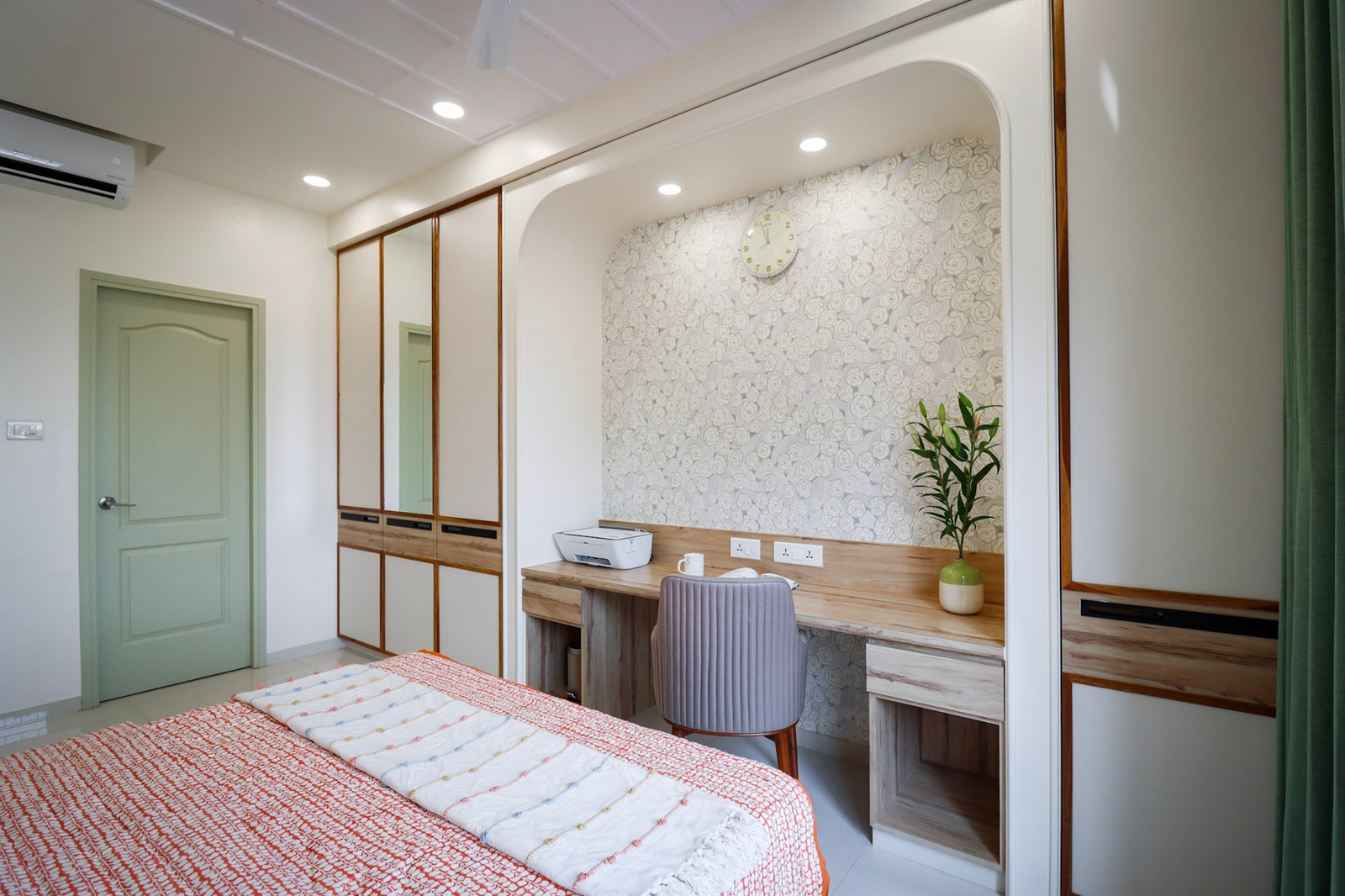 a room with a bed and desk