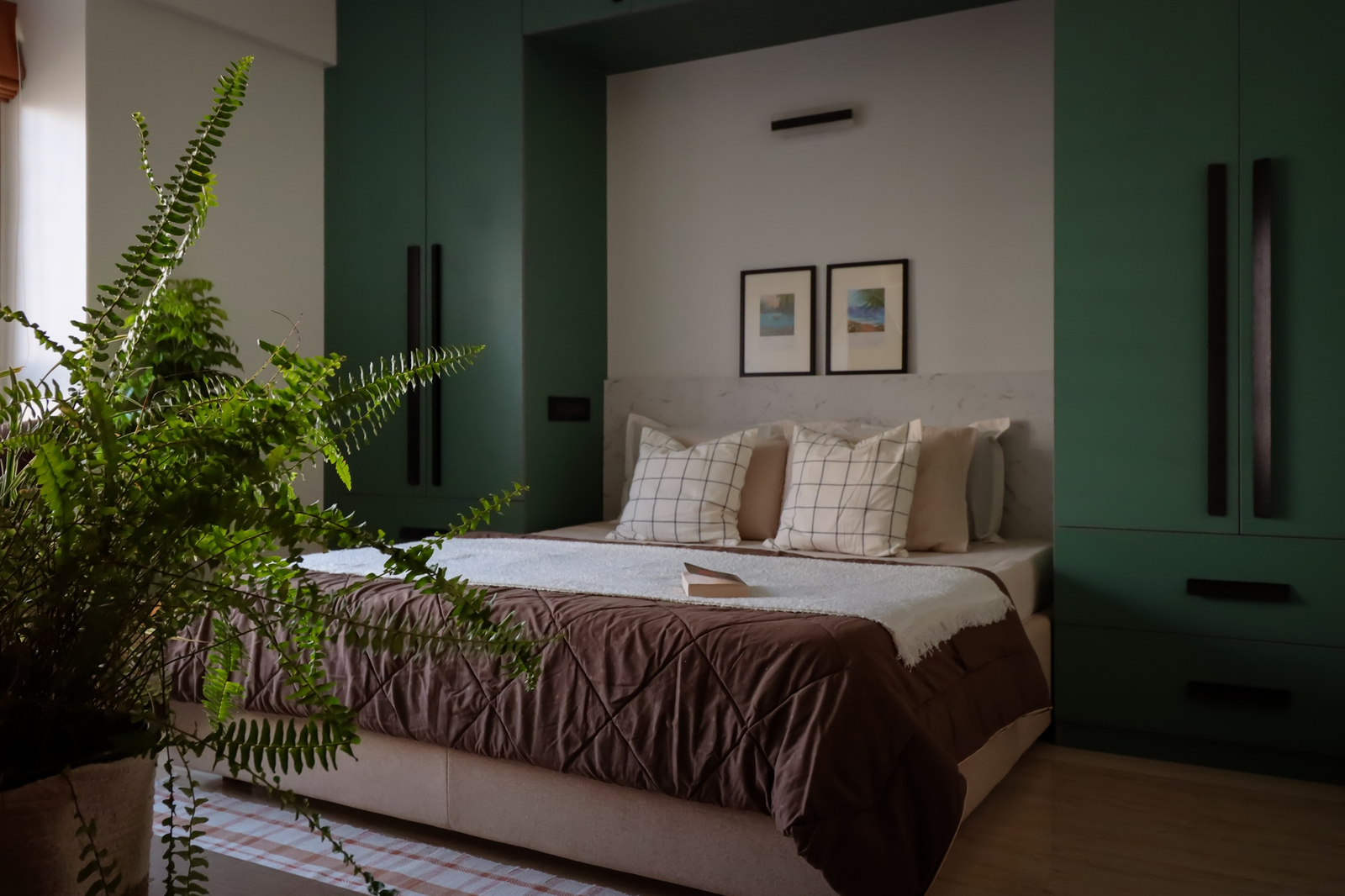 Cozy bedroom with green accents.